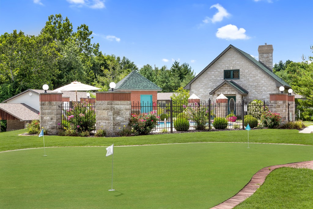 a home with a golf course in front of it