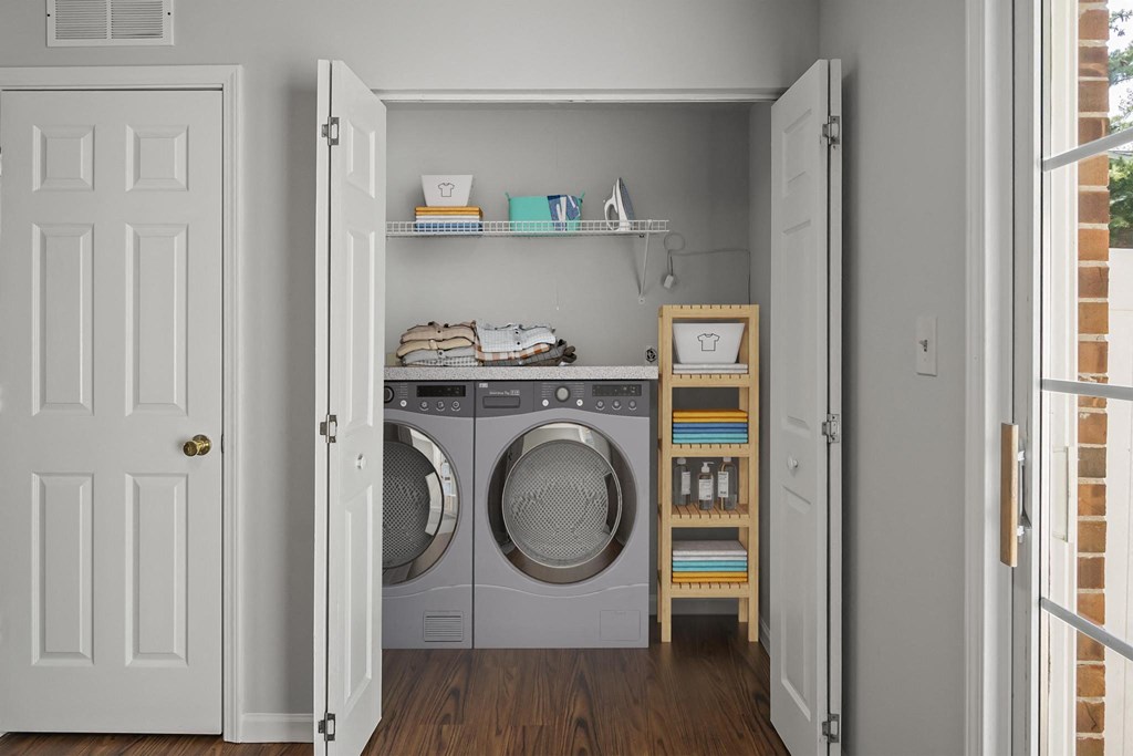 a small laundry room with a washer and dryer