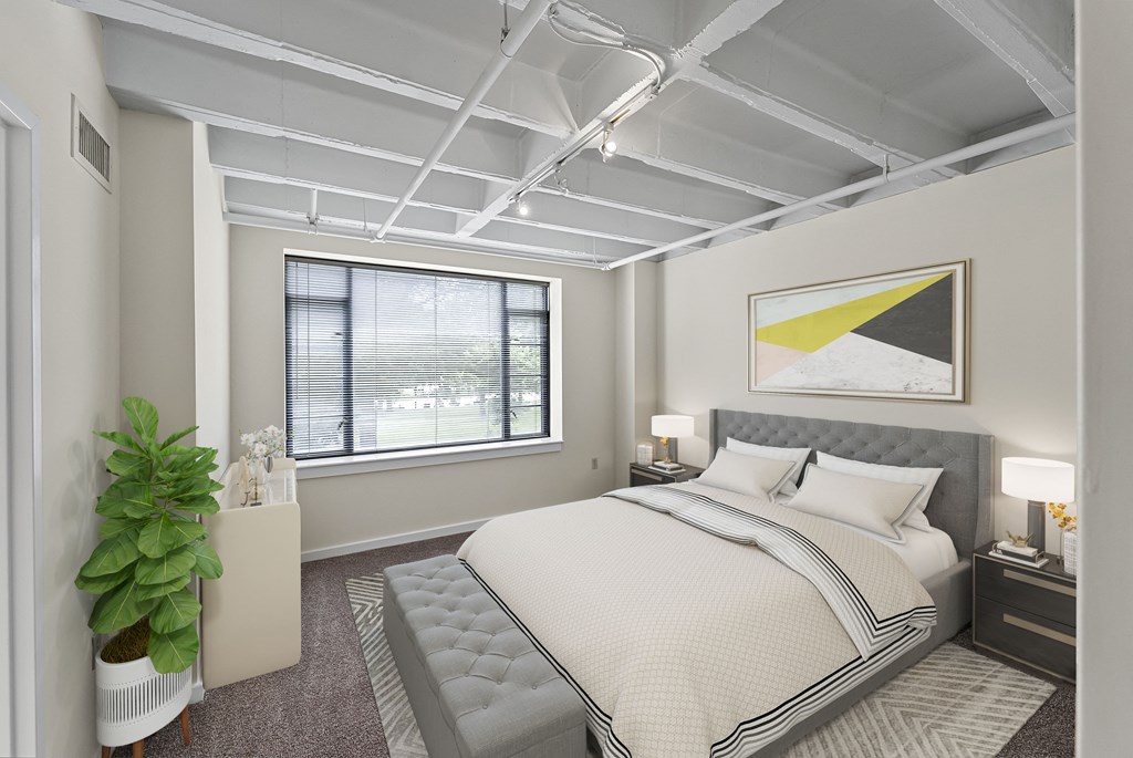 a bedroom with a bed and a window