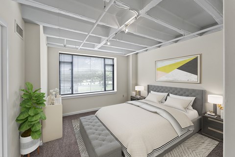 a bedroom with a bed and a window