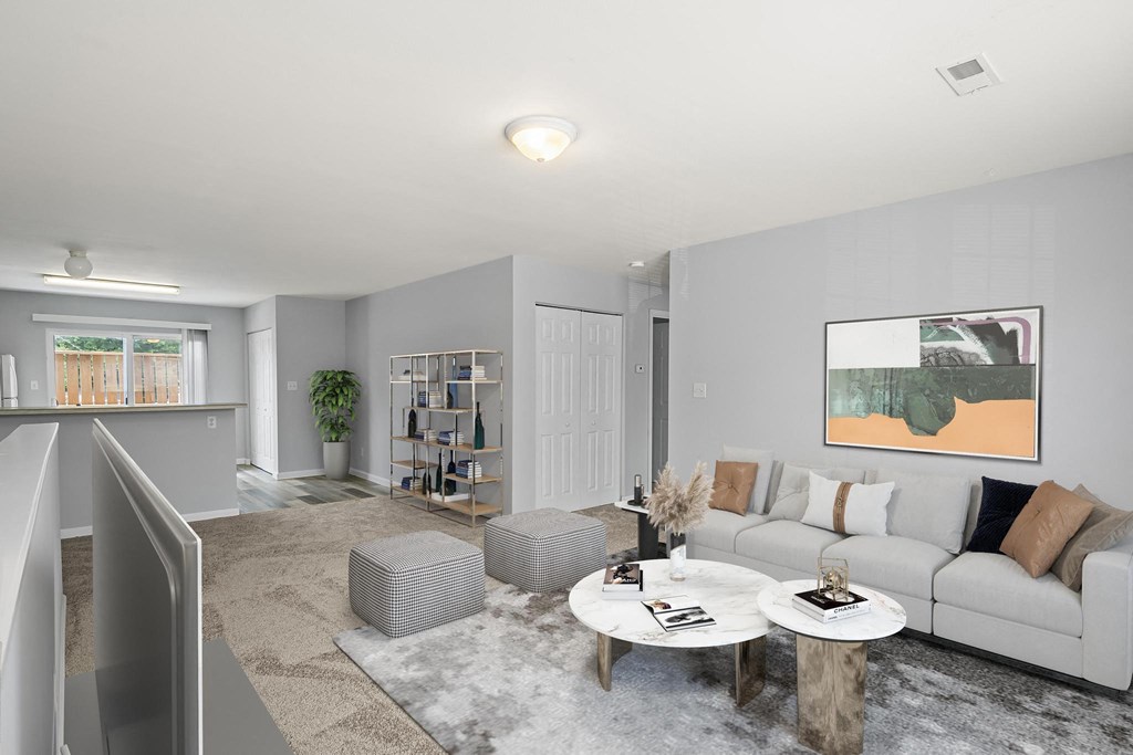 a living room with grey walls and a white couch