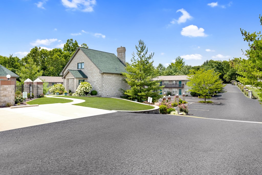 a house with a driveway and a street in front of it