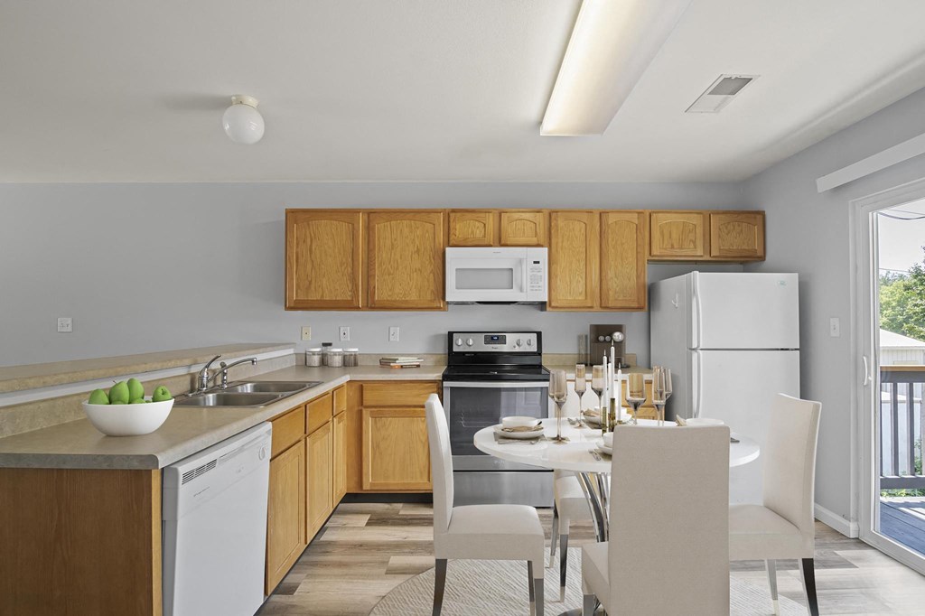 a kitchen and dining area in a 555 waverly unit