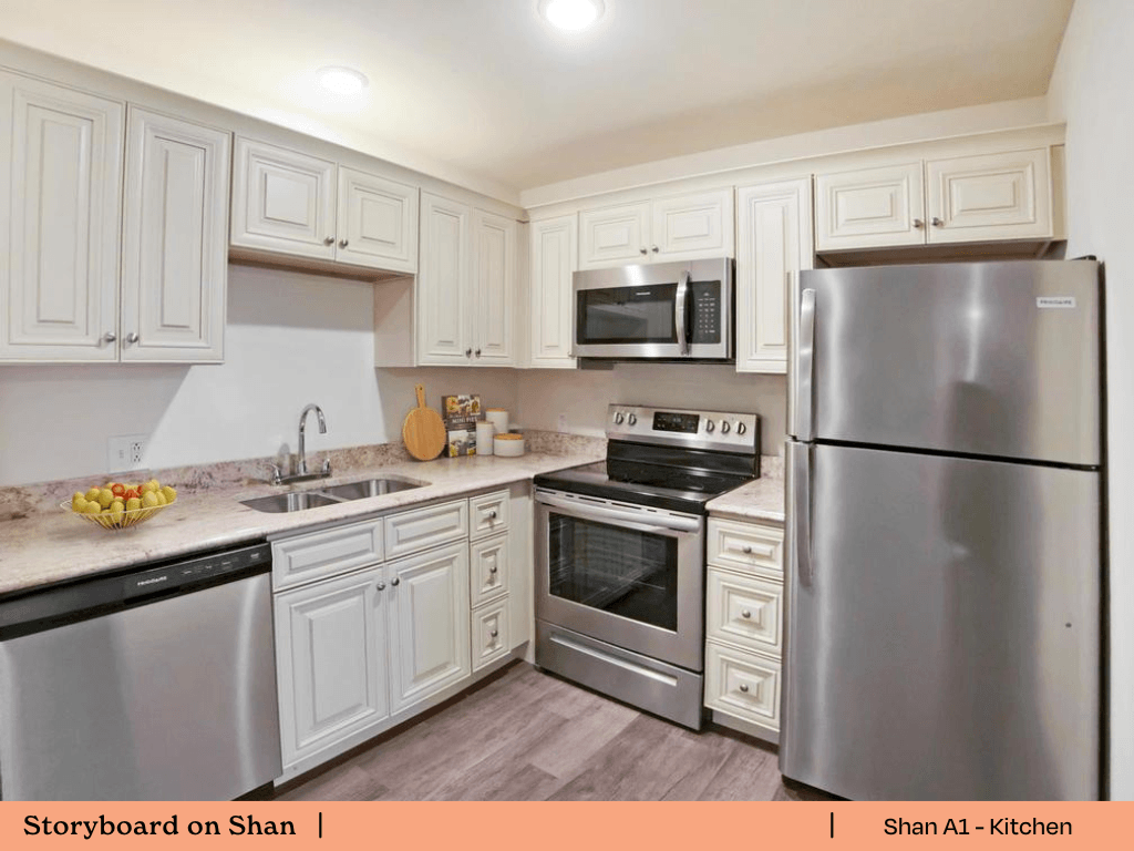 a kitchen with stainless steel appliances and white cabinets