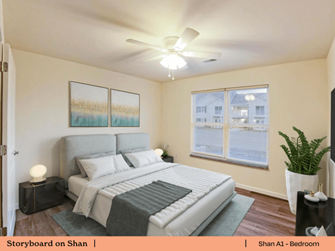 a bedroom with a large bed and a ceiling fan