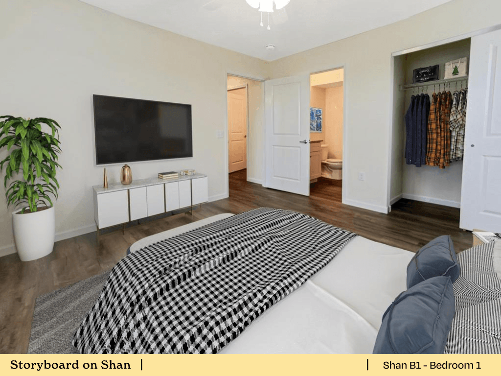 a bedroom with a bed and a tv