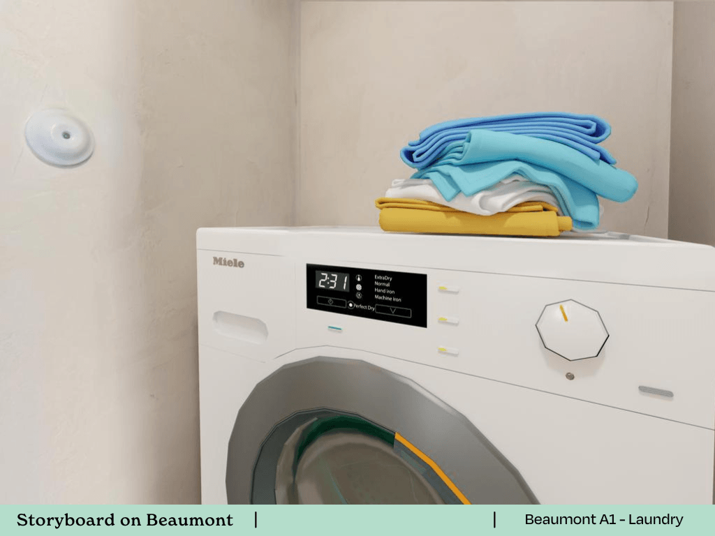 a laundry room with a washing machine and towels