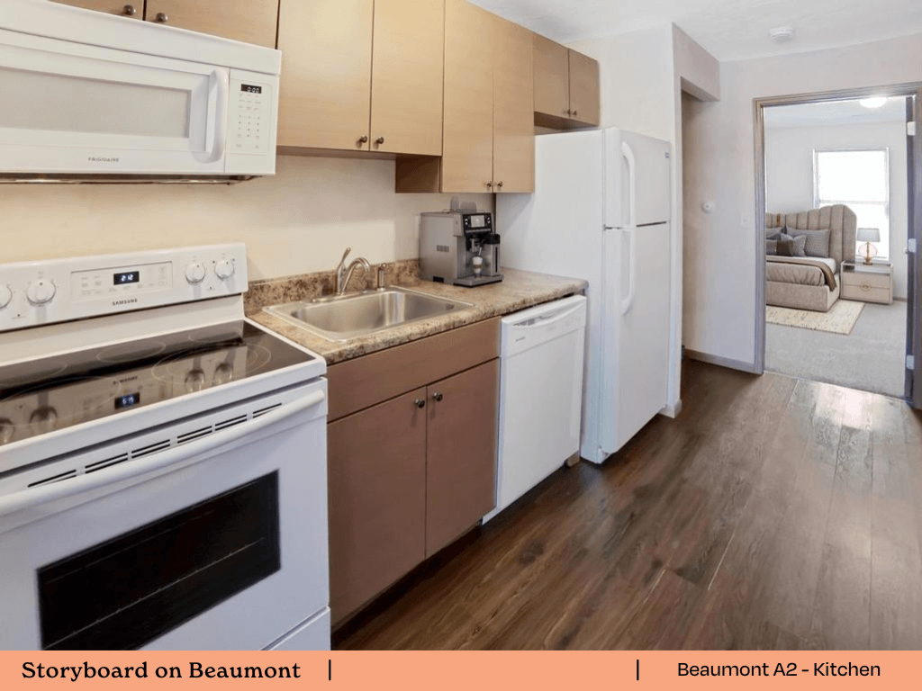 a kitchen with white appliances and wooden floors