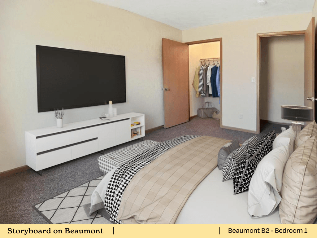 a bedroom with a bed and a television