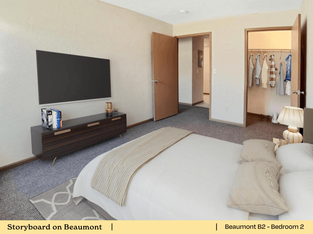 a bedroom with a bed and a tv in a hotel room
