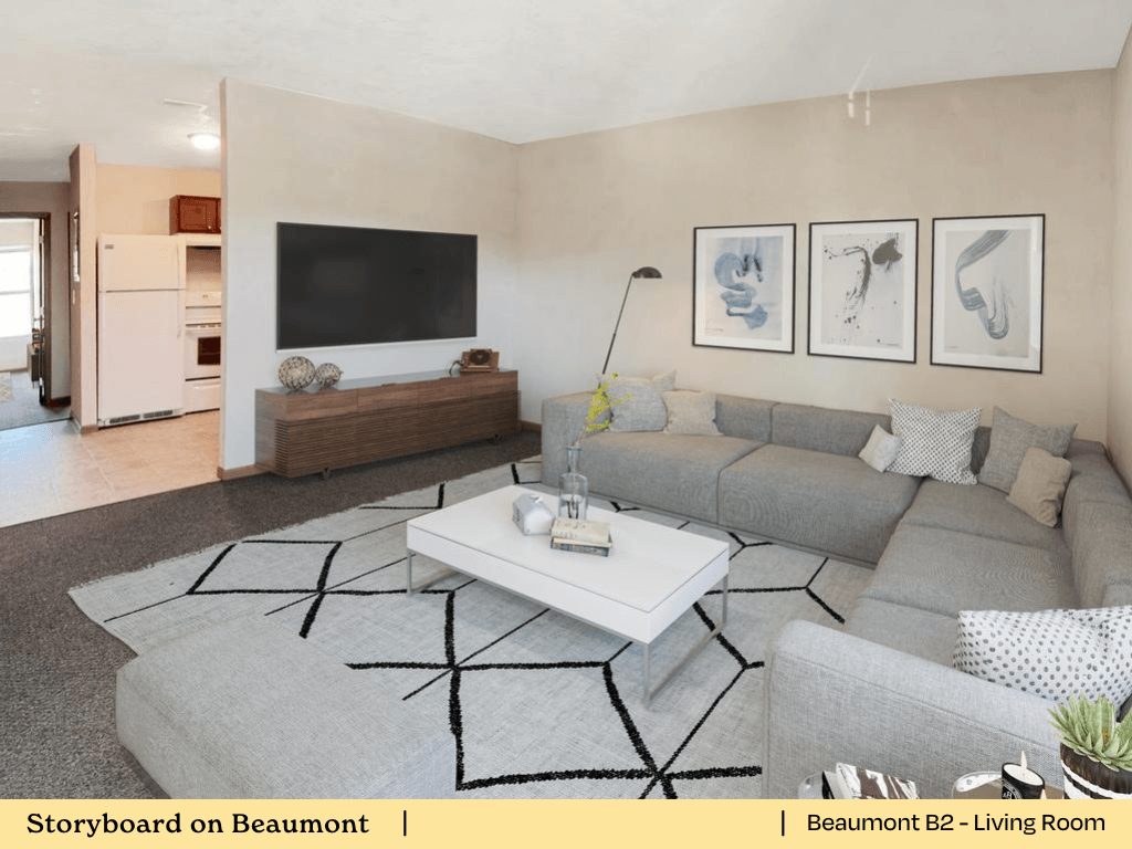 a living room with a gray couch and a white coffee table