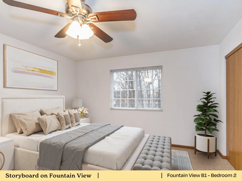 a bedroom with a bed and a ceiling fan