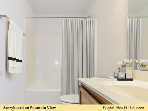 a bathroom with a sink and a tub and a shower