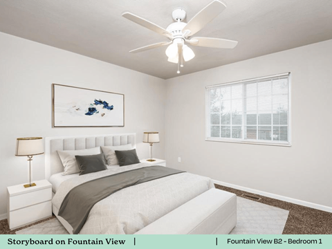 a bedroom with a bed and a ceiling fan