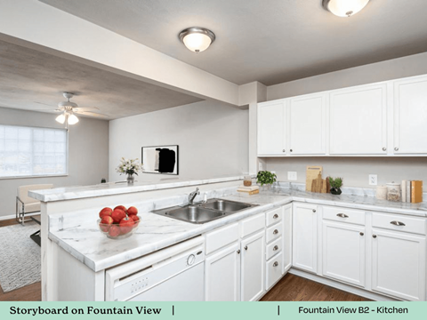 a kitchen with white cabinets and a sink