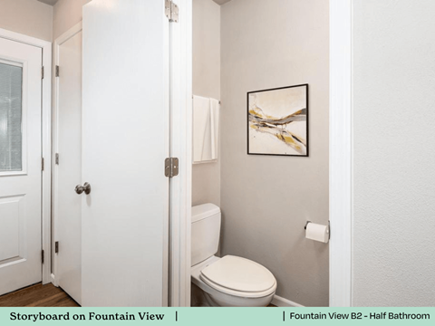 a bathroom with a toilet and a white door