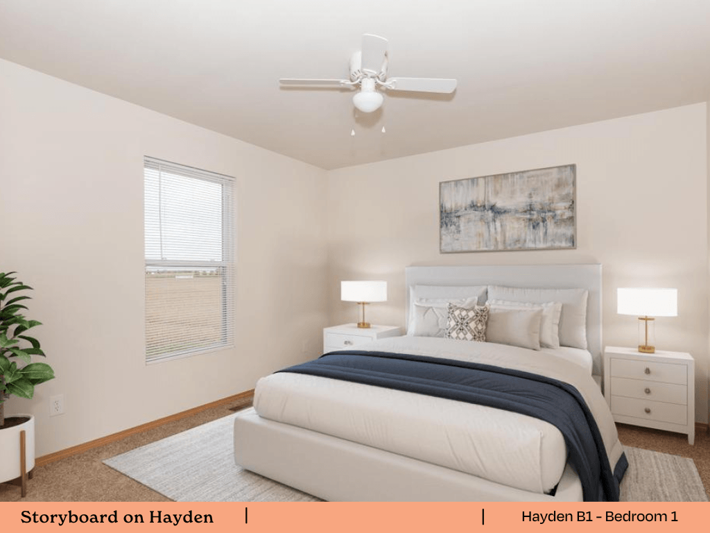 a bedroom with a bed and a ceiling fan