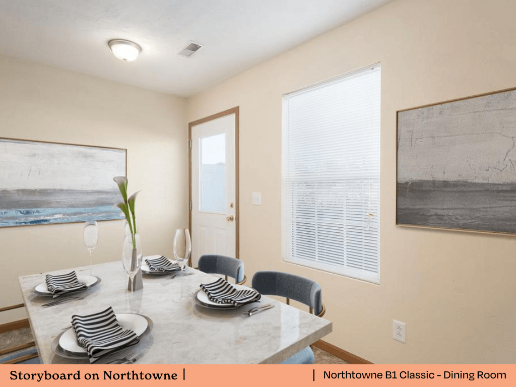 a dining room with a table and chairs