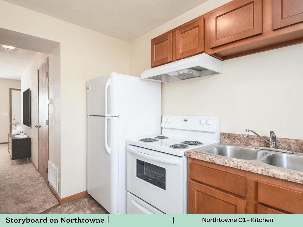 a kitchen with a stove refrigerator and sink