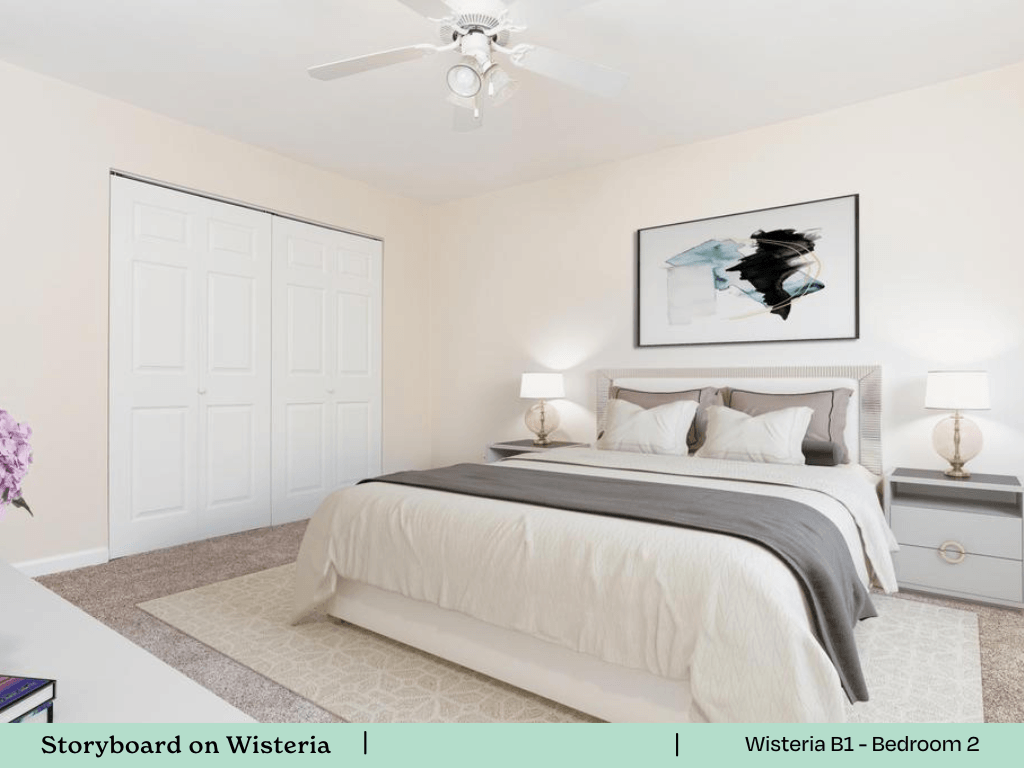 a bedroom with a bed and a ceiling fan