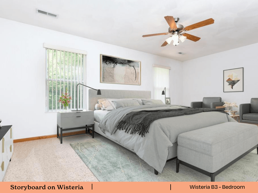 a bedroom with a bed and a ceiling fan