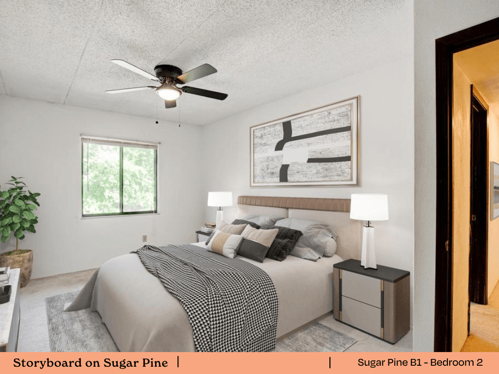 a bedroom with a bed and a ceiling fan
