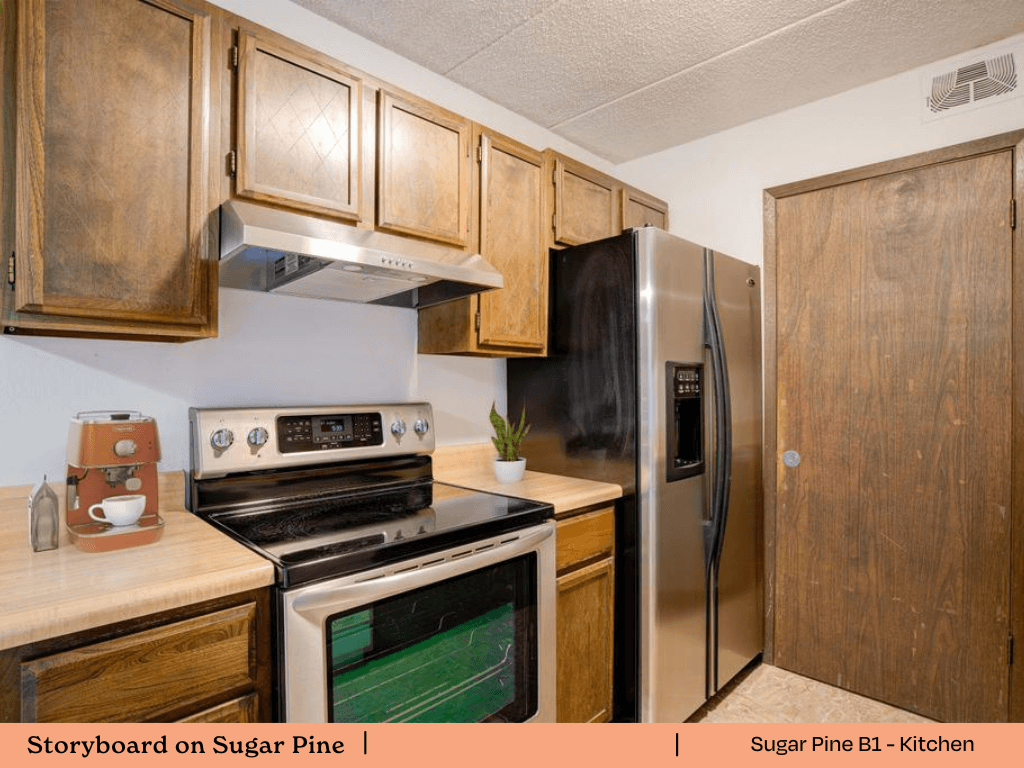 a kitchen with stainless steel appliances and wooden cabinets
