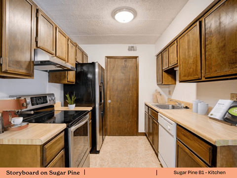 a kitchen with wooden cabinets and a black stove and refrigerator