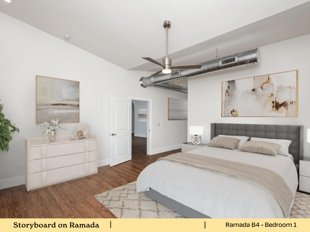 a bedroom with a bed and a ceiling fan