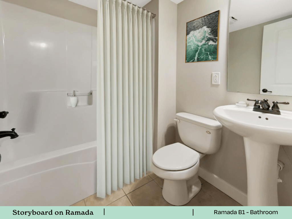 a bathroom with a toilet and a sink and a shower