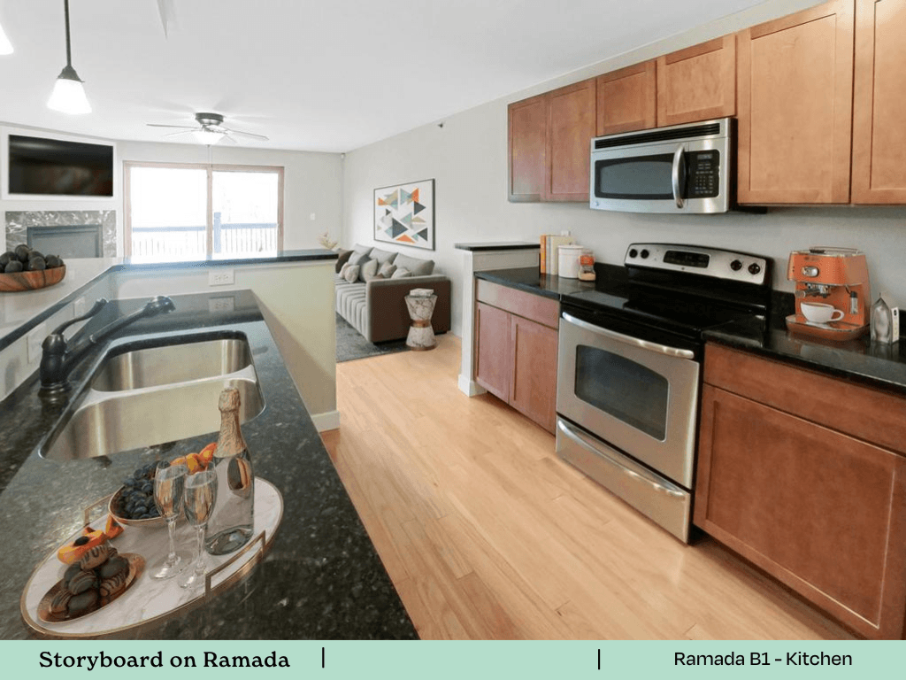 a kitchen and living room with wooden cabinets and stainless steel appliances