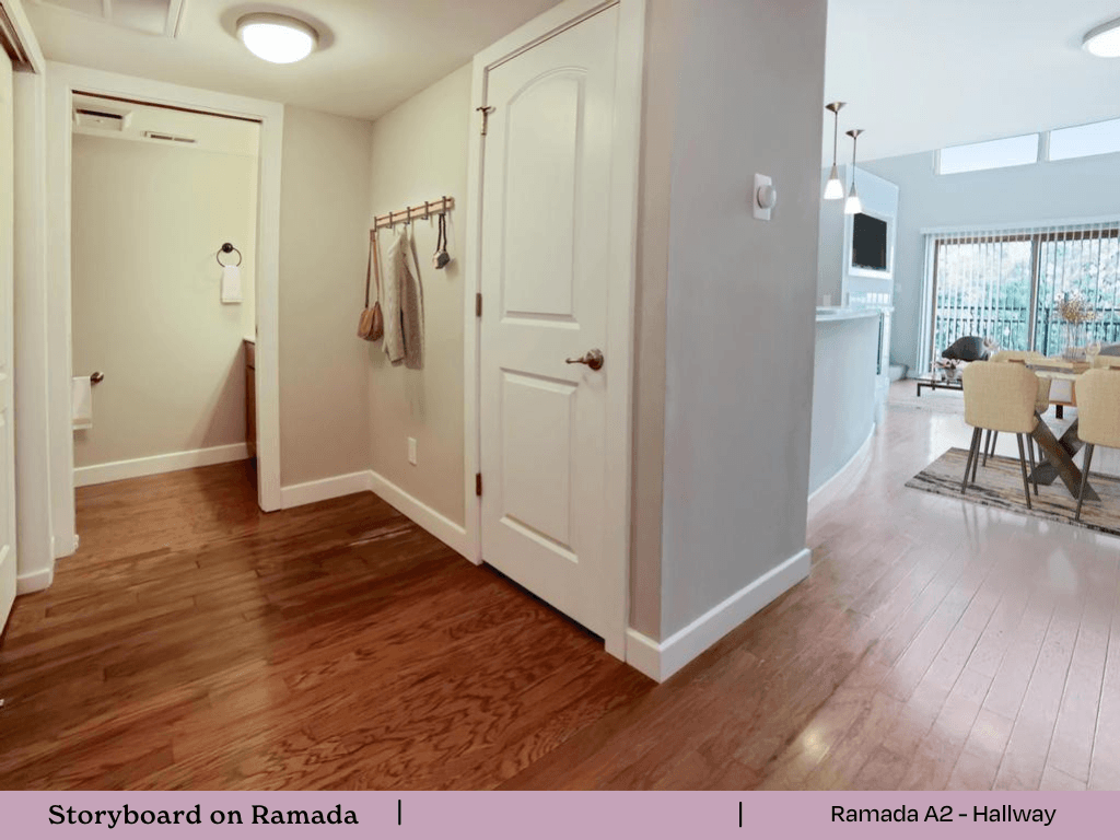 an open living room and dining room with a door to a closet