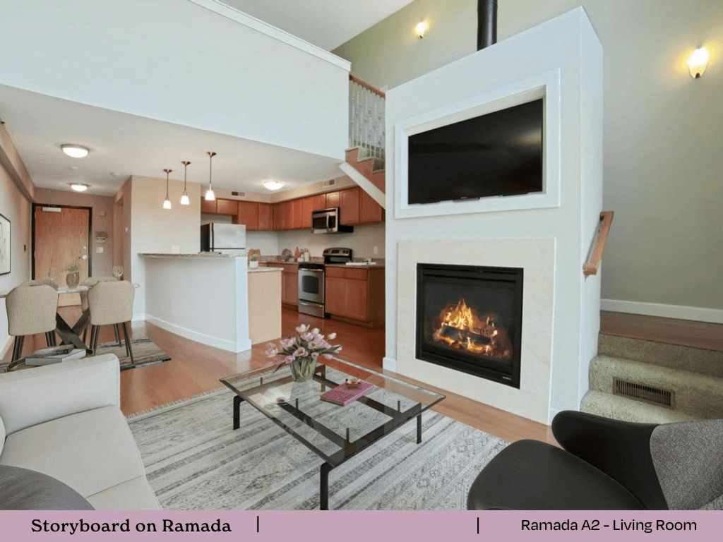 a living room with a fireplace  and a kitchen