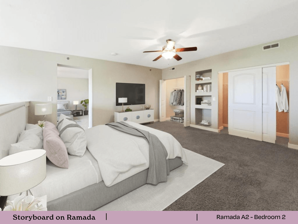 a bedroom with a bed and a ceiling fan