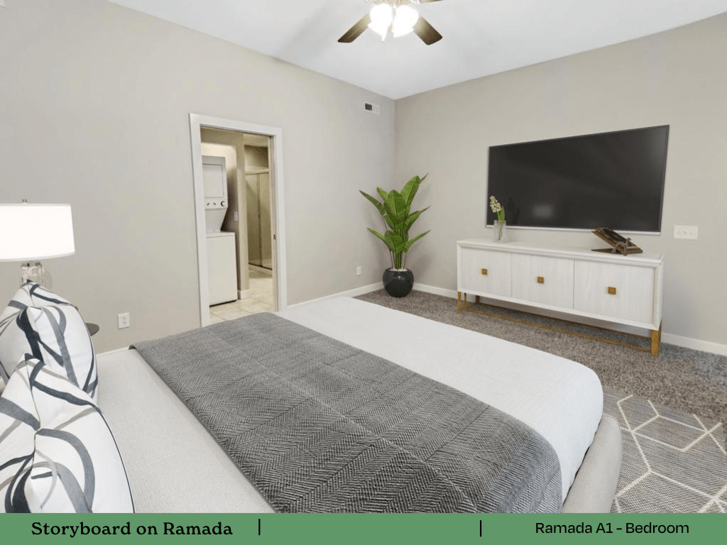 a bedroom with a bed and a tv