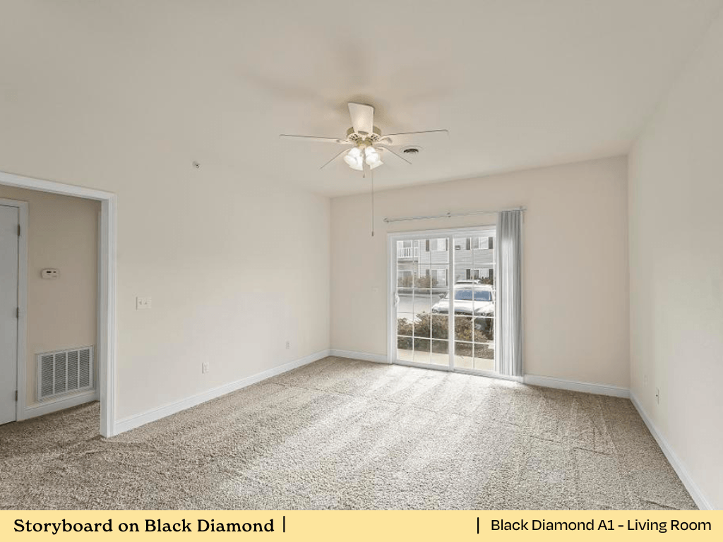 an empty living room with white walls and a ceiling fan