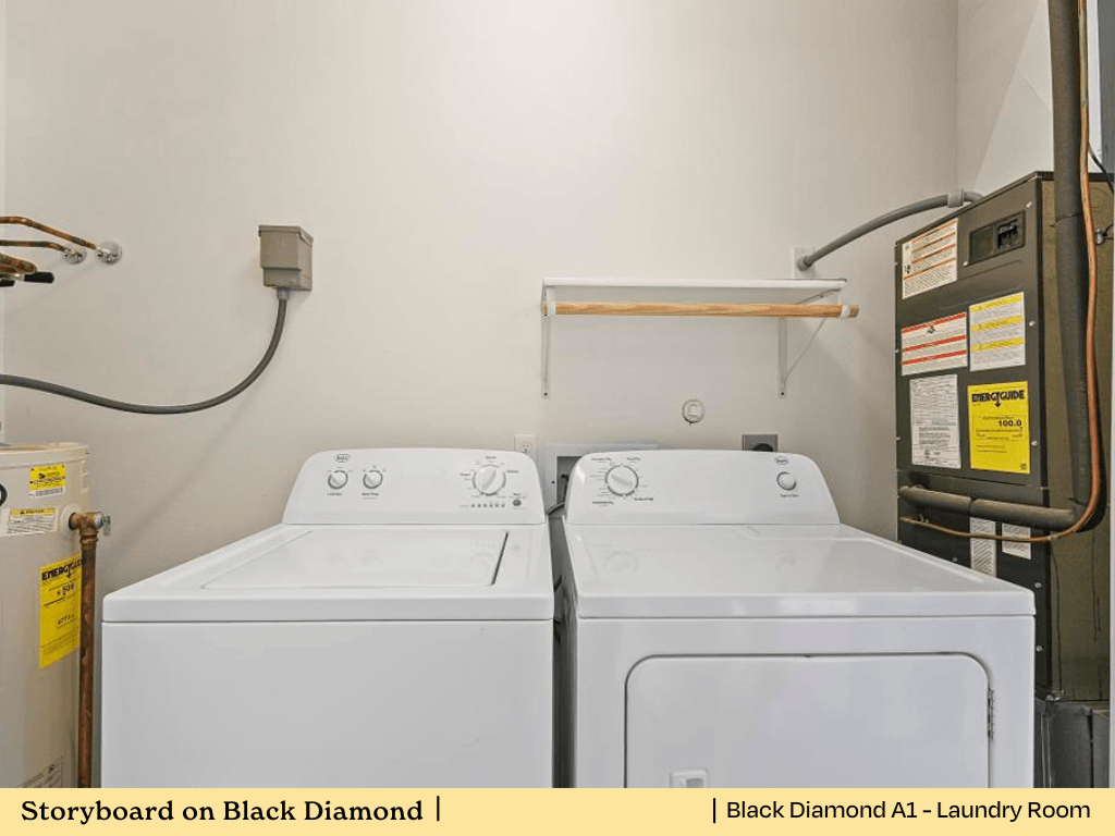a laundry room with two washes and a dryer