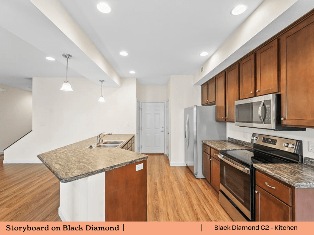 a kitchen with wooden cabinets and stainless steel appliances