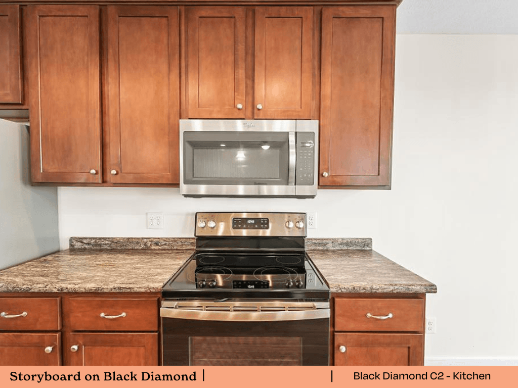 a kitchen with wooden cabinets and a stove and a microwave