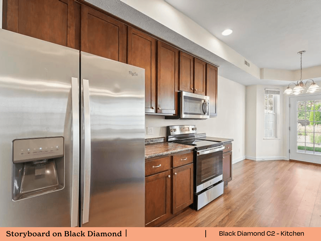 a kitchen with stainless steel appliances and wooden cabinets