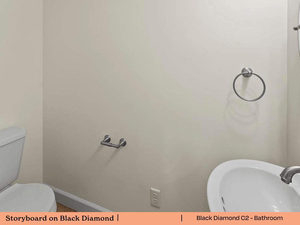 a white bathroom with a sink and a toilet