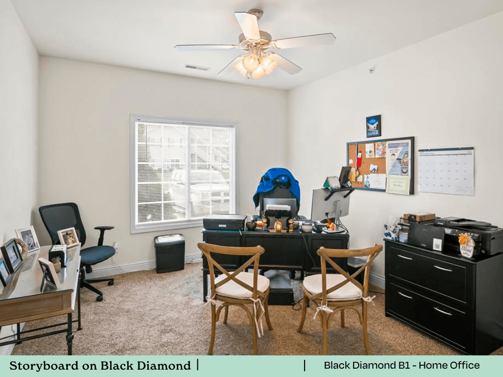 a living room with a desk and a