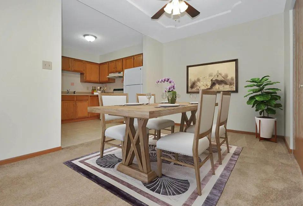 a dining room with a wooden table and chairs