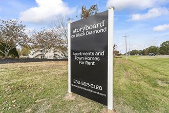 a sign for storyboard on back diamond apartments and town homes for rent