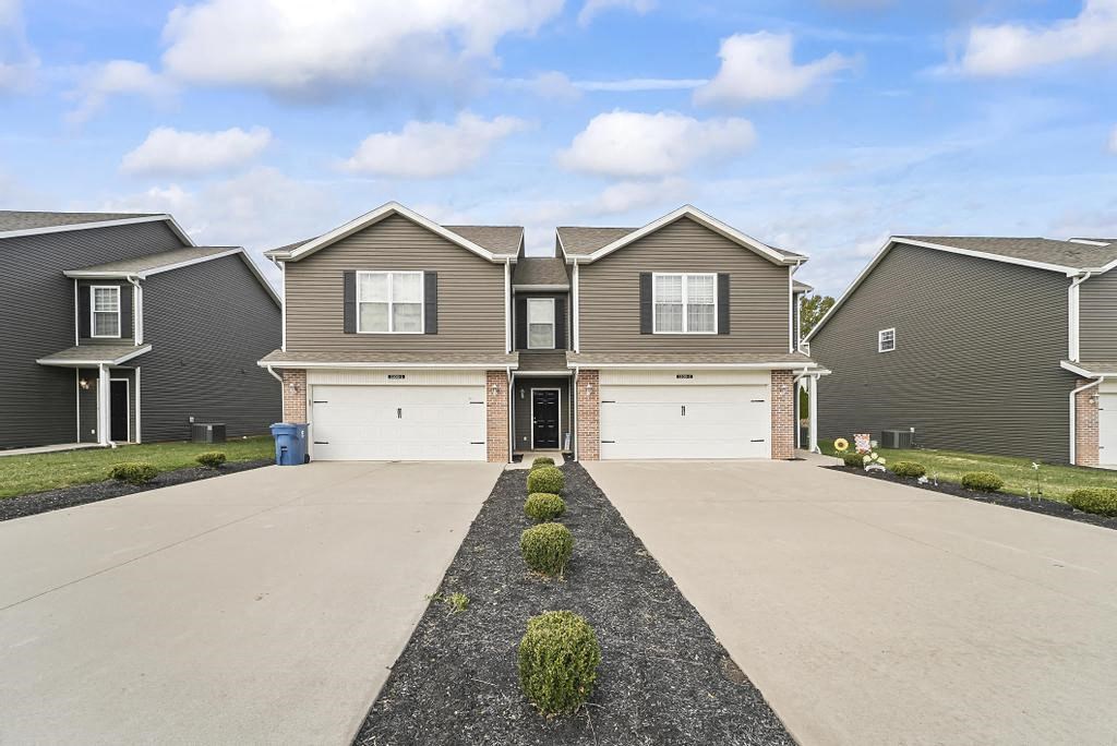 a house with a driveway in front of it