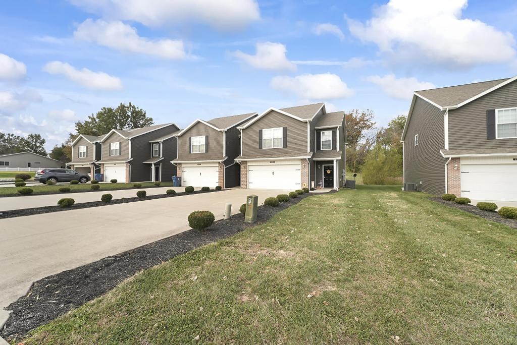 a group of houses on the side of a road