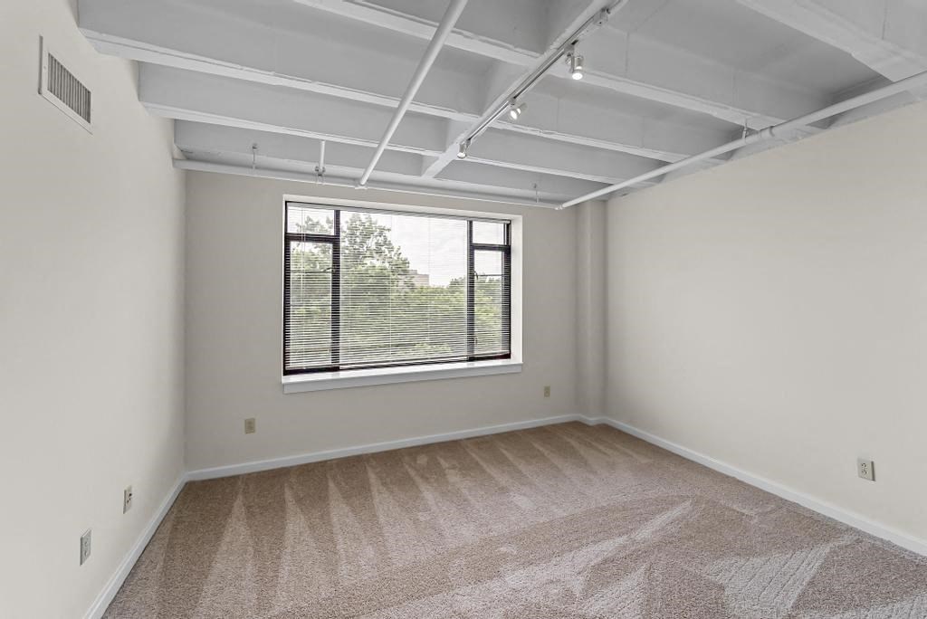 an empty room with a large window