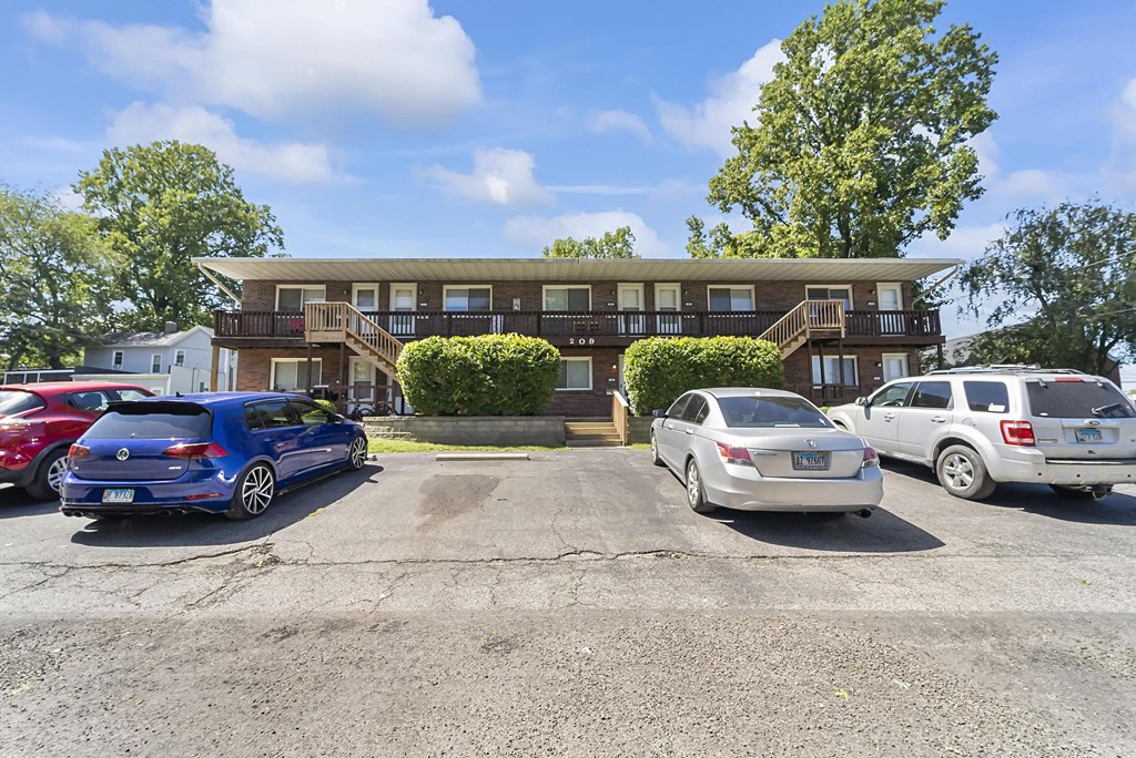 this is a photo of the parking lot at the whispering winds apartments in pearland, tx