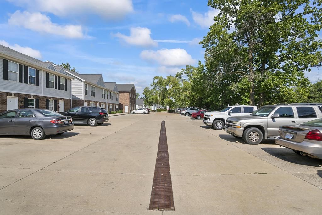 a long strip of brick in the middle of a parking lot