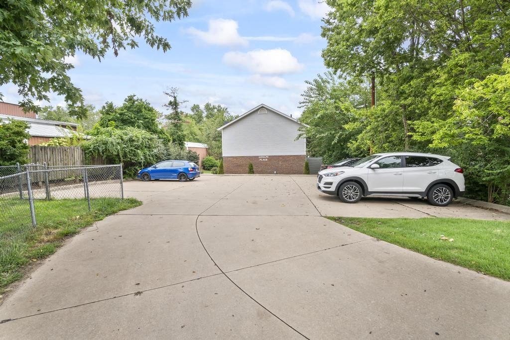 a car parked in a driveway in front of a house